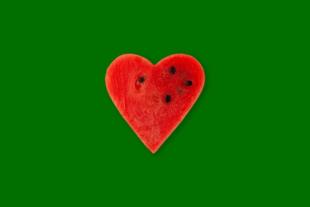 Red Watermelon pulp heart on green Watermelon slice Season sale fruits and berries Positive emotions