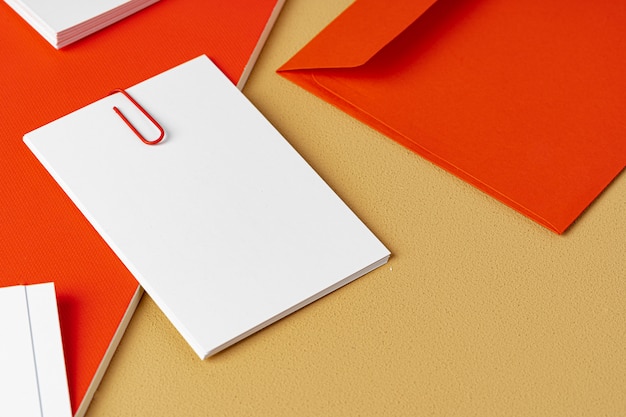 Red and white blank branding paper on beige background