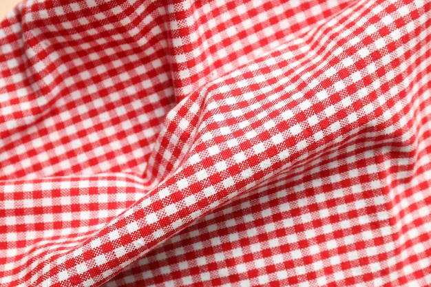 Red and white checkered tablecloth close up