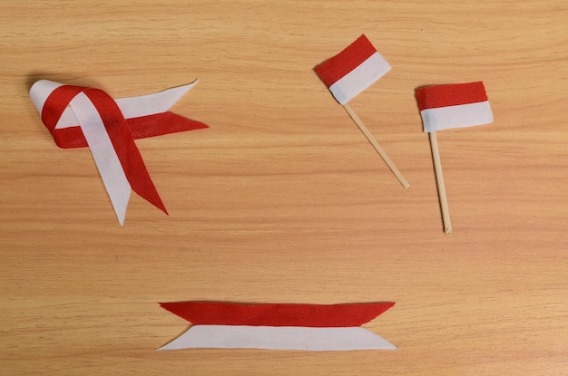 Red and white ribbon and flag with empty space for background concept of celebrating indonesian independence and indonesian national day