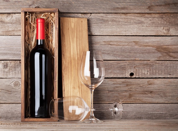 Red wine bottle and wine glasses