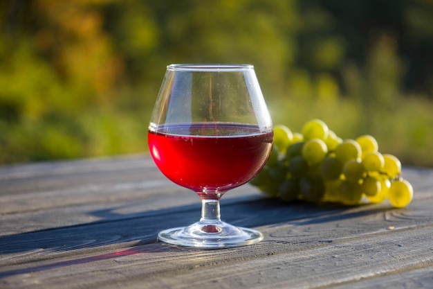 Red wine in a glass and bottle Blurred background