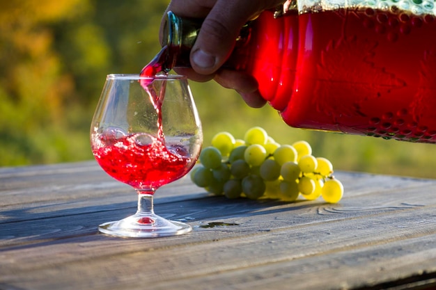 Red wine in a glass and bottle Blurred background