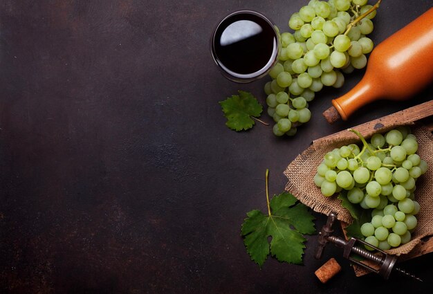 Red wine glass bottle and white grape