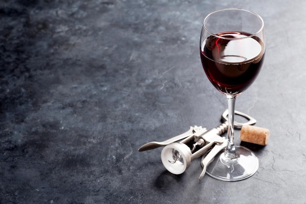 Red wine glass and corkscrew