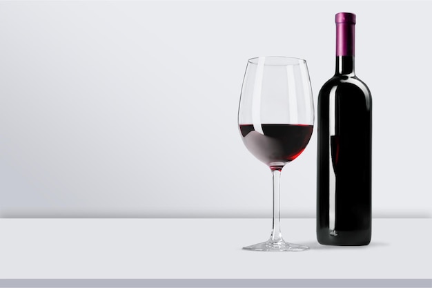 Red wine glass on wooden desk at wall background