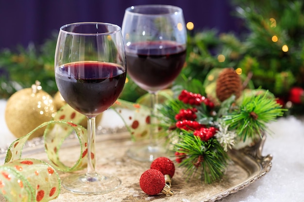 Red wine glasses on snow