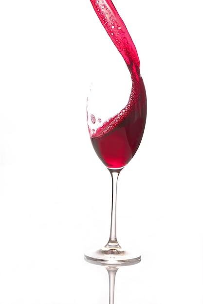 Red wine poured from a glass