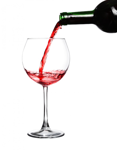 Red wine pouring on white background