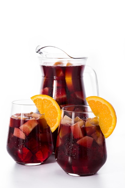 Red wine sangria in glass isolated on white