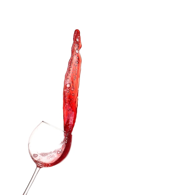 Red wine splashing from glass isolated on white background