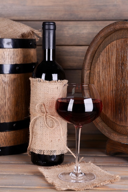 Red wine on table on wooden