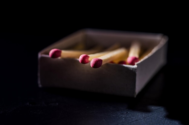 Red wooden matches on a light gray background Matchsticks with bright Red heads macro