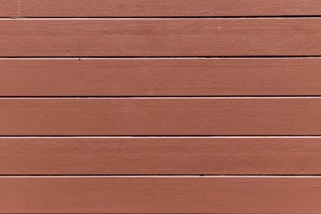 Red wooden plank wall background for design and decoration