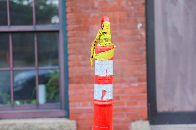 A red and yellow pole with a yellow and red cap on it.