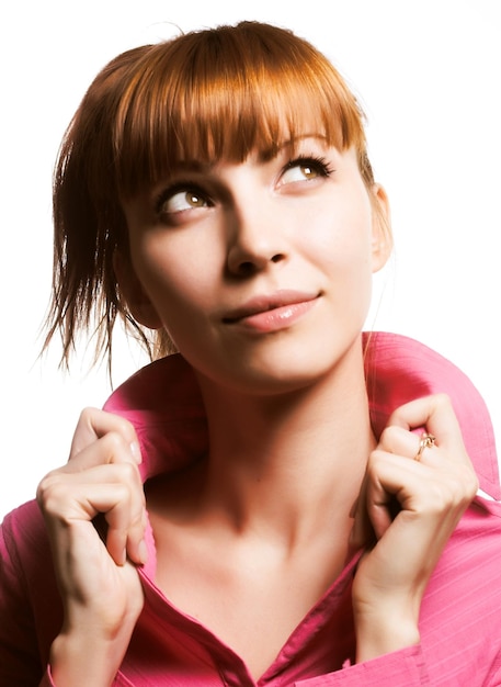 Redhair beauty over white background