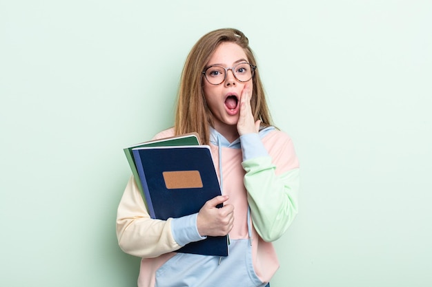 Redhair woman feeling shocked and scared student concept