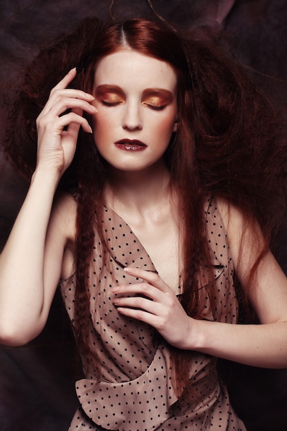 Redhair woman with bright creative make up