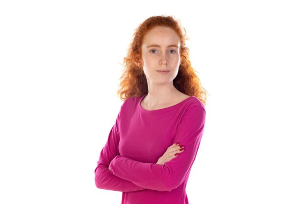 Redhaired young woman wearing a pink tshirt