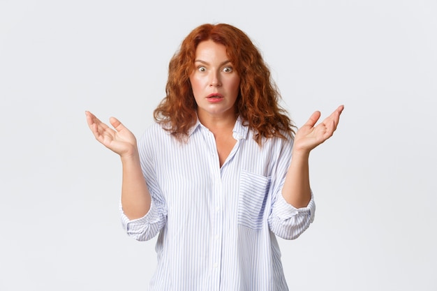 Redhead middle-aged woman posing