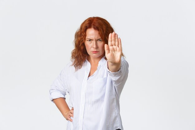 Redhead middle-aged woman posing