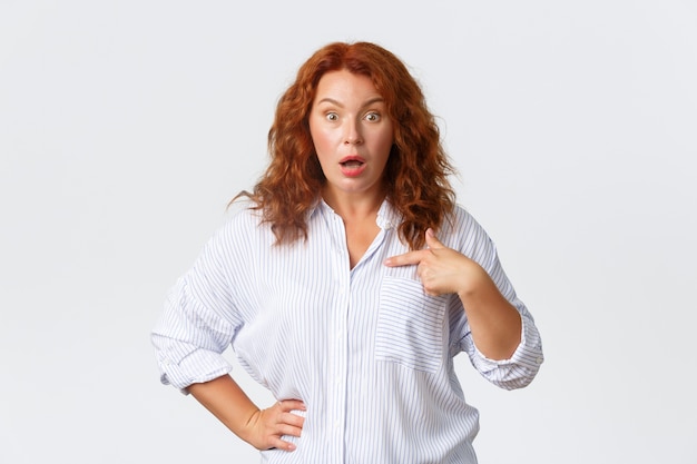 Redhead middle-aged woman posing