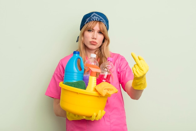 Redhead pretty woman feeling angry annoyed rebellious and aggressive housekeeping cleaner concept