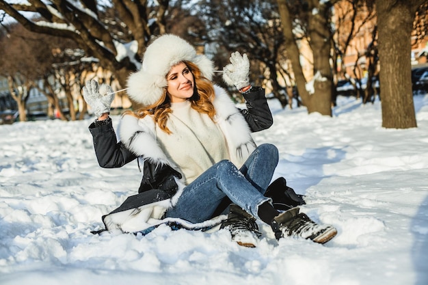 Redhead winter woman having fun outdoor