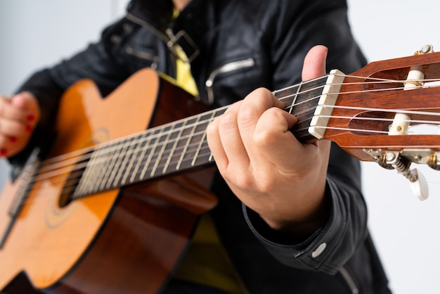 Redhead woman playing guitar