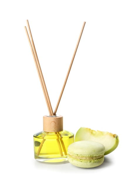 Reed diffuser, apple and cake on white background