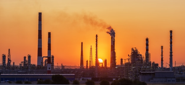 refinery factory silhouette at sunset