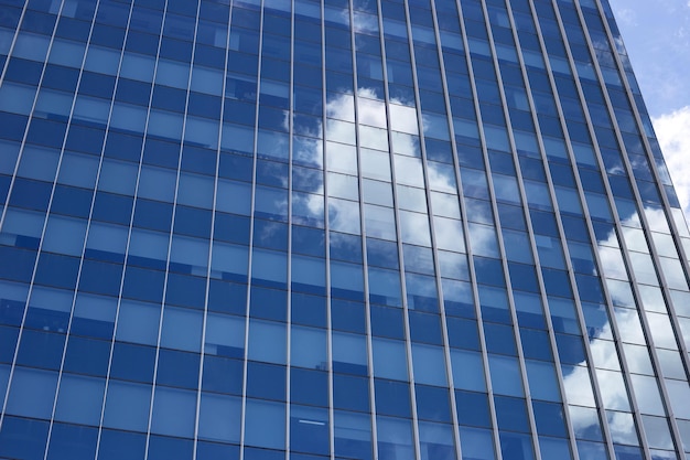 Reflection of blue sky and cloud on glass building