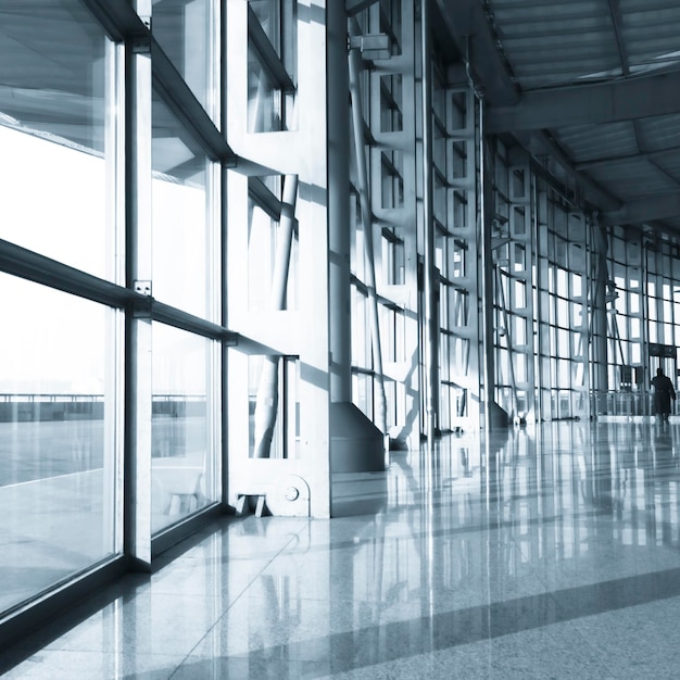 Photo reflection of building on glass window at airport