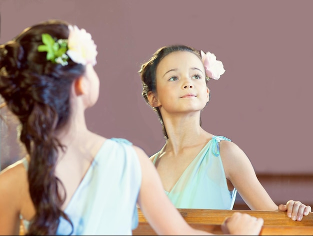 Reflection of graceful little ballerina closeup