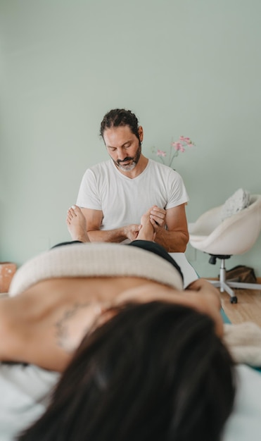 Reflexology office technician working with a patient39s feet