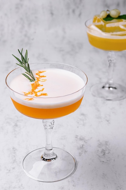 Refreshing cocktail decorated with sprig of rosemary