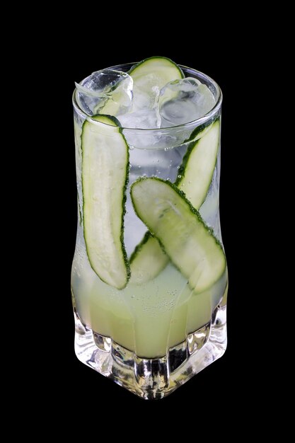 Refreshing cocktail in a glass on a black background Tonic and cucumber