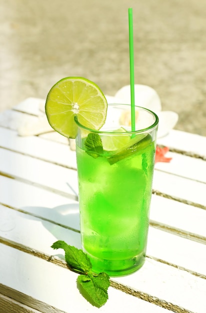 Refreshing cocktail on table outdoors