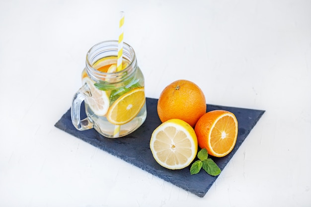 Refreshing detox water with lemon, orange and mint.