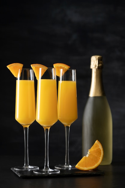 Refreshing mimosa cocktail with orange slices