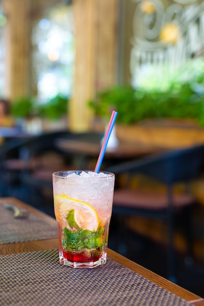 Refreshing mojito with crushed ice on hot summer day