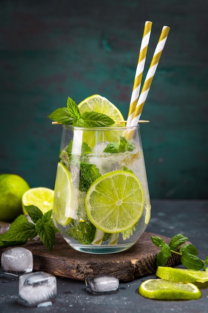 Refreshing mojito with lime mint and ice in a glass