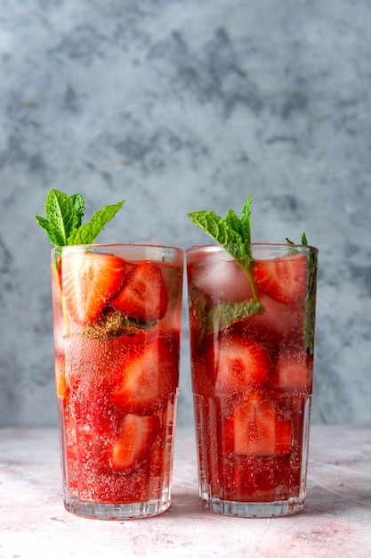 Refreshing strawberry drink with strawberry and mint. Delicious homemade summer beverage.