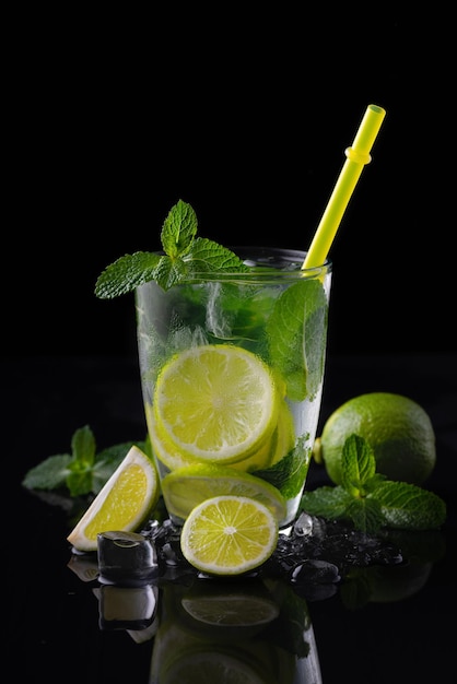 Refreshing summer alcoholic cocktail mojito with ice fresh mint and lime