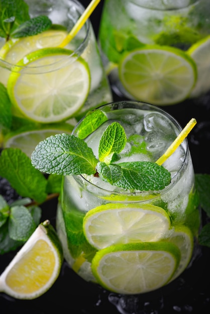 Refreshing summer alcoholic cocktail mojito with ice fresh mint and lime