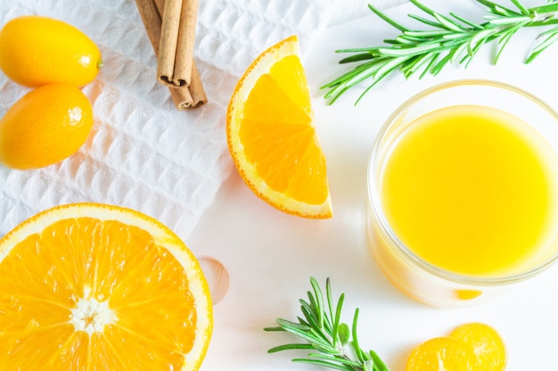 Refreshing summer citrus drink with orange, kumquat and rosemary