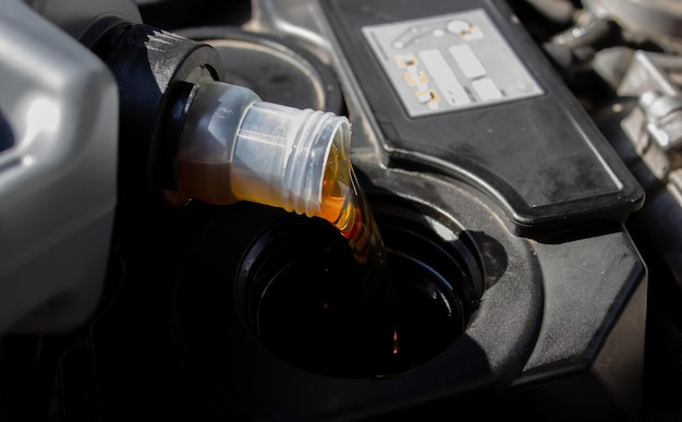 Refueling and pouring oil quality into the engine motor car Transmission and Maintenance Gear