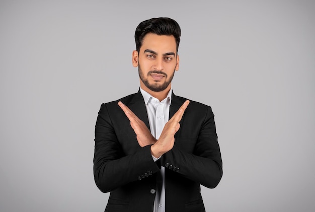 Refusal Concept Young Arab Businessman Showing Stop Gesture With Crossed Arms