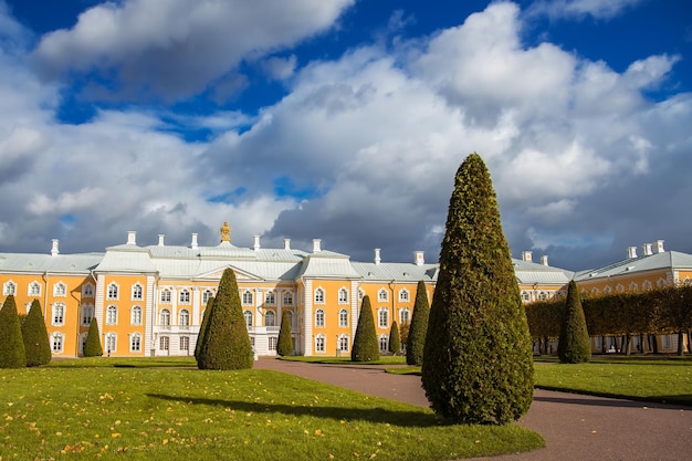 Regular park with neatly trimmed trees in front of the Peterhof Palace Petergof Russia