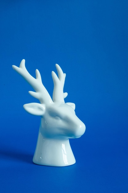 Reindeer head on white and blue background